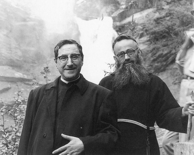Fr. Damasso, ofm cap, was the Holy Father's loyal friend and confessor   even before Siri became pope.  It is said that Fr. Damasso treated everyone like his beloved child.  The humour in this photo is that Fr. Damasso is up one step higher so that they appear to be of the same height.