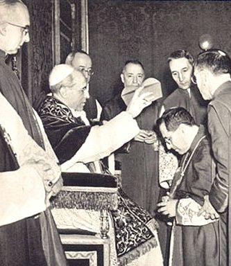 Archbishop Giuseppe Siri is here being raised to the Cardinalate.  He was the last Cardinal created by Pope Pius XII, and the youngest.